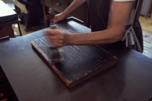 inking the block hand press